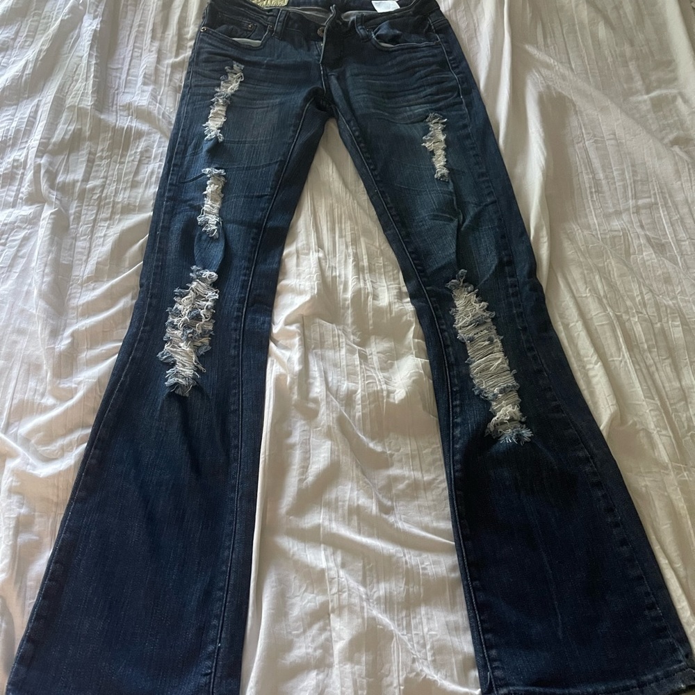 Distressed and boot cut Machine brand jeans